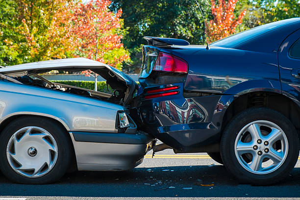 Auto accident involving two cars on a city street